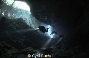 Diving in cenote by Cyril Buchet 
